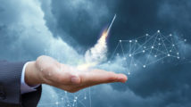 Rocket takes off from the hand of the businessman. Concept of start up.